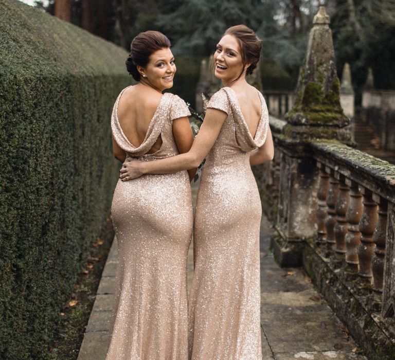 Bridesmaids In Pale Gold Sequinned Dresses // Christmas Pub Wedding At The Falcon Rotherwick With Bride In Alice By Watters And Candle Lit Wedding Ceremony Images By Rebecca Searle Photography