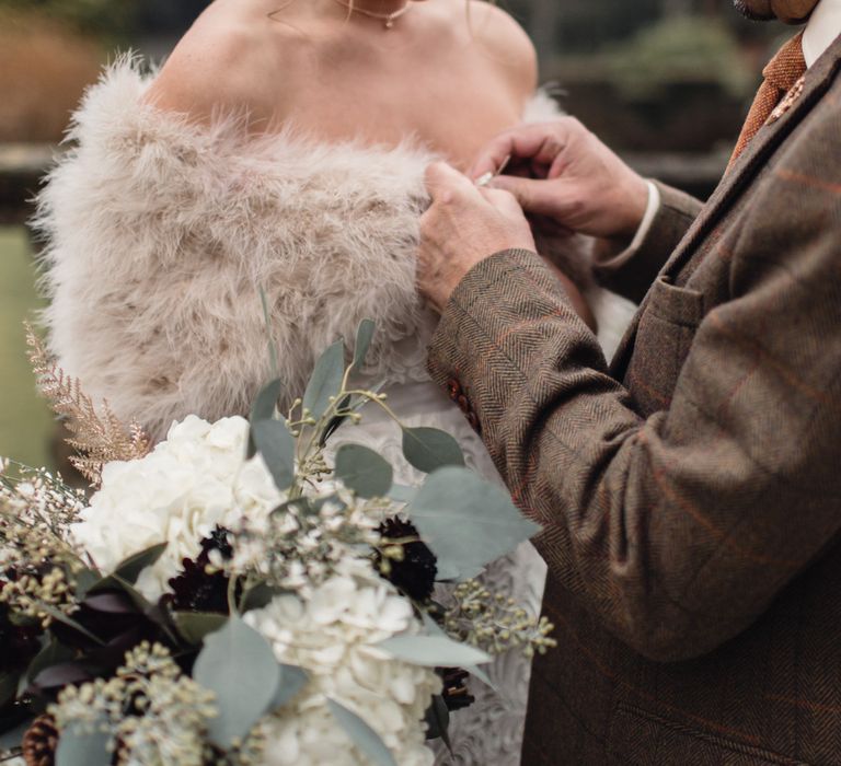 Winter Wedding Bouquet // Christmas Pub Wedding At The Falcon Rotherwick With Bride In Alice By Watters And Candle Lit Wedding Ceremony Images By Rebecca Searle Photography