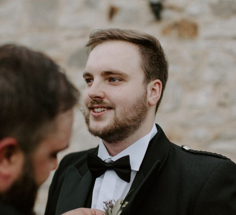 Groom Fixing Buttonhole