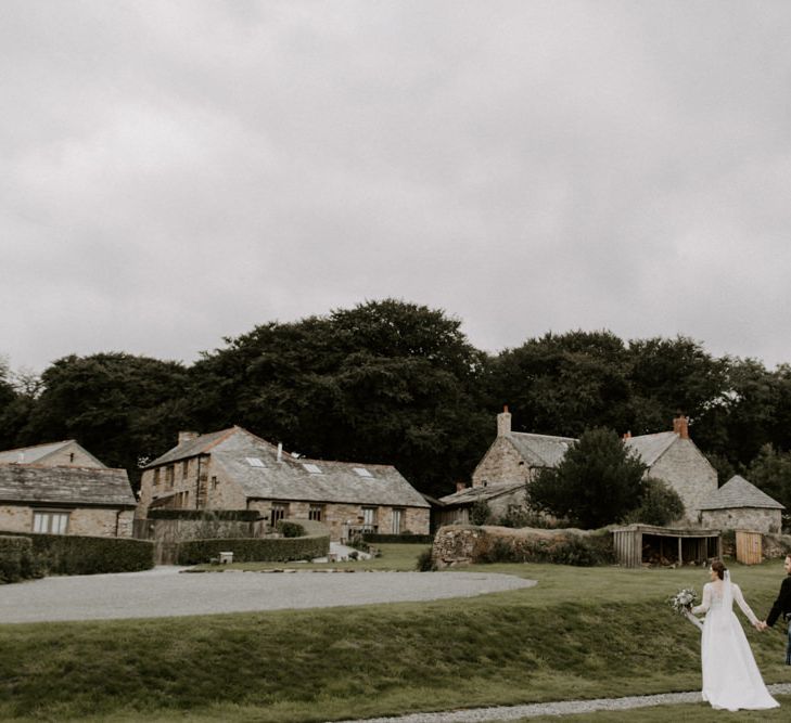 Bride and Groom Walk Up To Venue