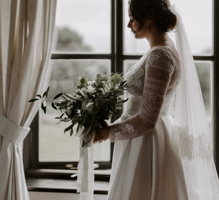 Bride During Wedding Preparations with Bouquet