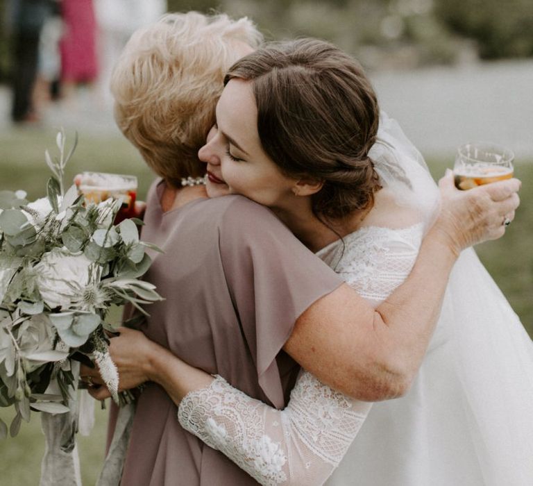 Bride Greeting Guest Holding Flower Bouquet