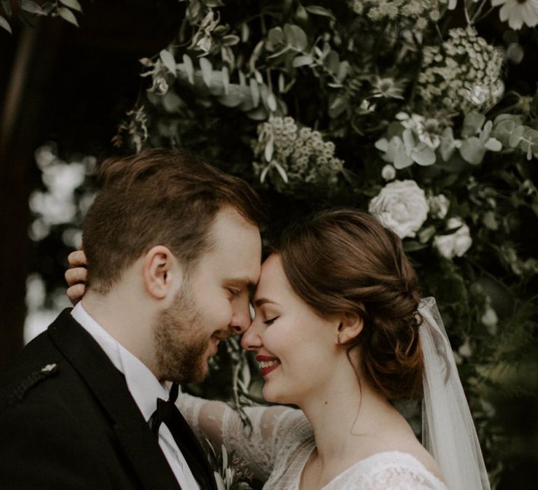 Bride and Groom Embrace After Ceremony