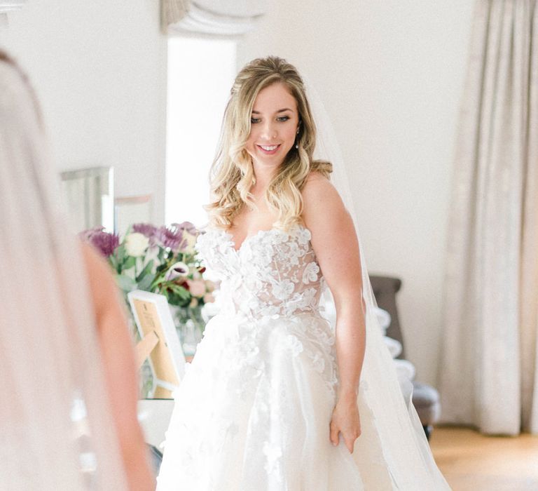 Bride in Strapless Liz Martinez Ballgown Wedding Dress with Embroidered Flowers | Cathedral Length Veil in Blush Soft Tulle | Half Up Half Down Bridal Hair Style | Country Tipi Wedding with Macramé Arch and Hanging Flowers | Sarah-Jane Ethan Photography