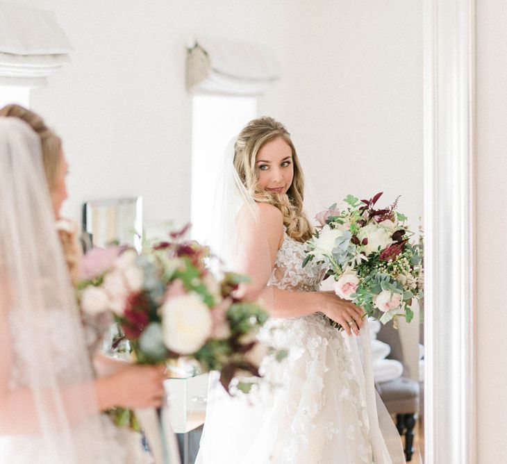 Bride in Strapless Liz Martinez Ballgown Wedding Dress with Embroidered Flowers | Cathedral Length Veil in Blush Soft Tulle | Half Up Half Down Bridal Hair Style | Oversized Bridal Bouquet of White Peonies, Blush Astlibe, Trailing Greenery and Burgundy Eucalyptus | Country Tipi Wedding with Macramé Arch and Hanging Flowers | Sarah-Jane Ethan Photography