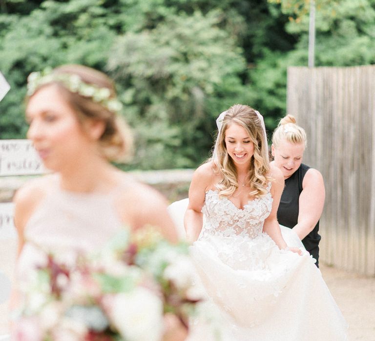 Bride in Strapless Liz Martinez Ballgown Wedding Dress with Embroidered Flowers | Cathedral Length Veil in Blush Soft Tulle | Half Up Half Down Bridal Hair Style | Oversized Bridal Bouquet of White Peonies, Blush Astlibe, Trailing Greenery and Burgundy Eucalyptus | Bridesmaids in Blush Pink Rita Roushdy Dresses | Flower Crowns | Country Tipi Wedding with Macramé Arch and Hanging Flowers | Sarah-Jane Ethan Photography