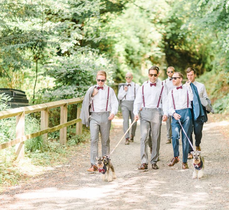 Miniature Schnauzer Ring Bearers | Groom in Navy Blue Suit with Burgundy Braces, Bow Tie and Brogues | Groomsmen in Grey Suits with Burgundy Braces, Bow Ties and Brogues | Country Tipi Wedding with Macramé Arch and Hanging Flowers | Sarah-Jane Ethan Photography