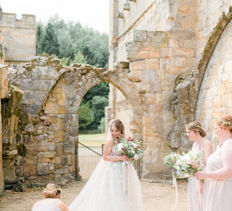 Bride in Strapless Liz Martinez Ballgown Wedding Dress with Embroidered Flowers | Cathedral Length Veil in Blush Soft Tulle | Bouquets of White Peonies, Blush Astlibe, Trailing Greenery and Burgundy Eucalyptus | Bridesmaids in Blush Pink Rita Roushdy Dresses | Flower Crowns | Country Tipi Wedding with Macramé Arch and Hanging Flowers | Sarah-Jane Ethan Photography