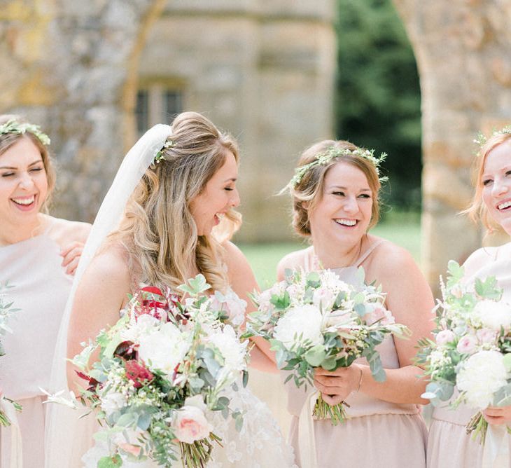 Bride in Strapless Liz Martinez Ballgown Wedding Dress with Embroidered Flowers | Cathedral Length Veil in Blush Soft Tulle | Bouquets of White Peonies, Blush Astlibe, Trailing Greenery and Burgundy Eucalyptus | Bridesmaids in Blush Pink Rita Roushdy Dresses | Flower Crowns | Country Tipi Wedding with Macramé Arch and Hanging Flowers | Sarah-Jane Ethan Photography