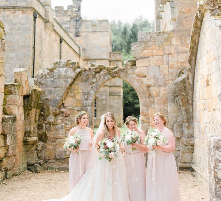 Bride in Strapless Liz Martinez Ballgown Wedding Dress with Embroidered Flowers | Cathedral Length Veil in Blush Soft Tulle | Bouquets of White Peonies, Blush Astlibe, Trailing Greenery and Burgundy Eucalyptus | Bridesmaids in Blush Pink Rita Roushdy Dresses | Flower Crowns | Country Tipi Wedding with Macramé Arch and Hanging Flowers | Sarah-Jane Ethan Photography