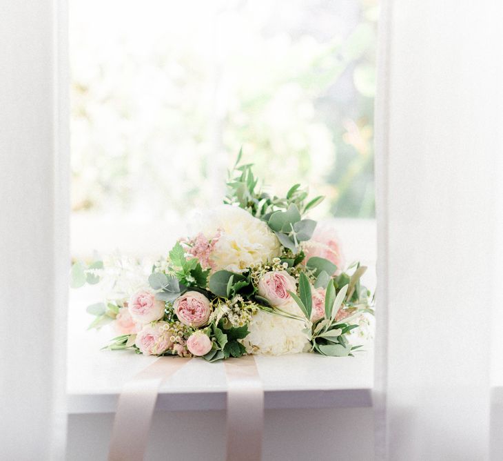 Bridal Bouquet of White Peonies, Blush Astlibe, Trailing Greenery and Burgundy Eucalyptus | Country Tipi Wedding with Macramé Arch and Hanging Flowers | Sarah-Jane Ethan Photography