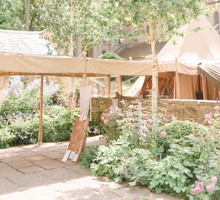 Tipi at Brinkburn Priory | Country Tipi Wedding with Macramé Arch and Hanging Flowers | Sarah-Jane Ethan Photography