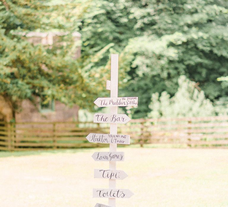 Wedding Signpost | Country Tipi Wedding with Macramé Arch and Hanging Flowers | Sarah-Jane Ethan Photography