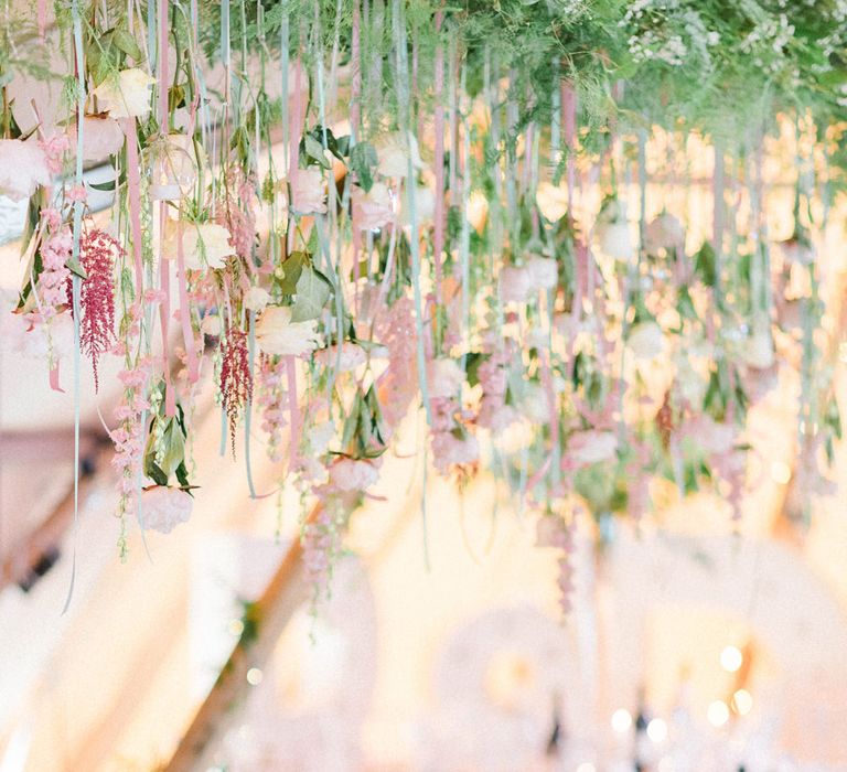 Top Table | Hanging Floral Installation with Trailing Ribbons and Glass Orbs | Country Tipi Wedding with Macramé Arch and Hanging Flowers | Sarah-Jane Ethan Photography