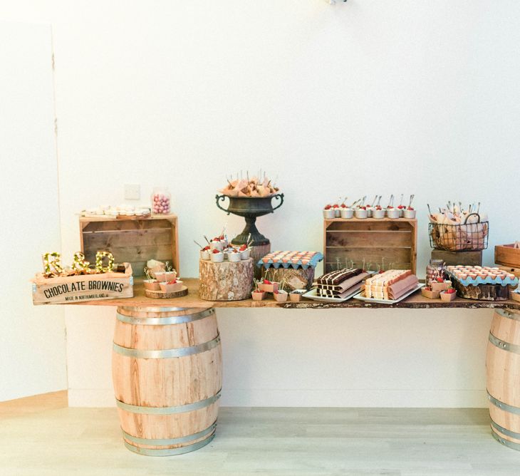 Dessert Table | Brownies | Crème Brulees | Profiteroles | Macrons | Truffles | Eton Messes | White Chocolate Panna Cotta | Country Tipi Wedding with Macramé Arch and Hanging Flowers | Sarah-Jane Ethan Photography