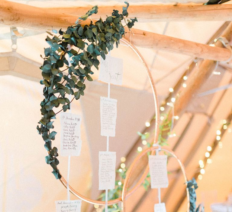 Wedding Reception Decor | Copper Hoops and Eucalytpus Table Plan | Country Tipi Wedding with Macramé Arch and Hanging Flowers | Sarah-Jane Ethan Photography