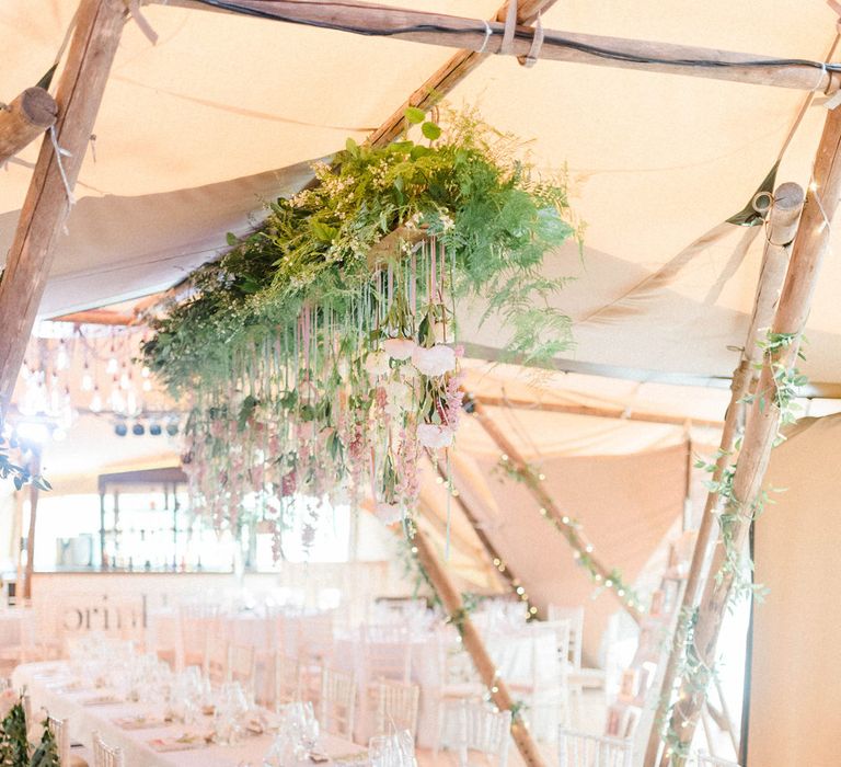 Wedding Reception Decor | Hanging Floral Installation with Trailing Ribbons and Glass Orbs | Top Table | Country Tipi Wedding with Macramé Arch and Hanging Flowers | Sarah-Jane Ethan Photography