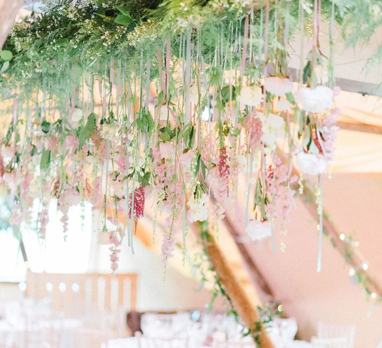 Wedding Reception Decor | Hanging Floral Installation with Trailing Ribbons and Glass Orbs | Top Table | Country Tipi Wedding with Macramé Arch and Hanging Flowers | Sarah-Jane Ethan Photography