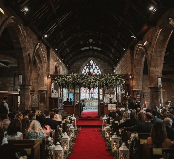 Guests Wait For Bride and Groom in Decorated Church