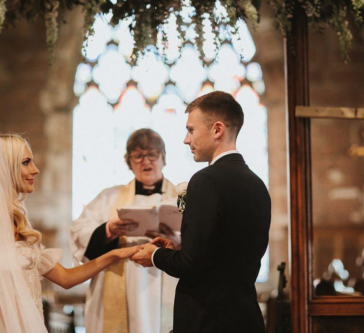 Bride and Groom Say Vows At Church Wedding