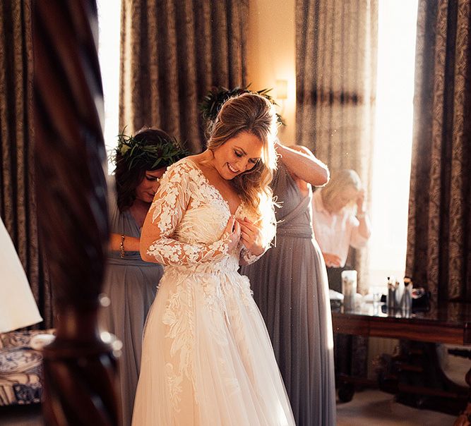 Bride gets in to her Riki Dalal wedding dress before celebration