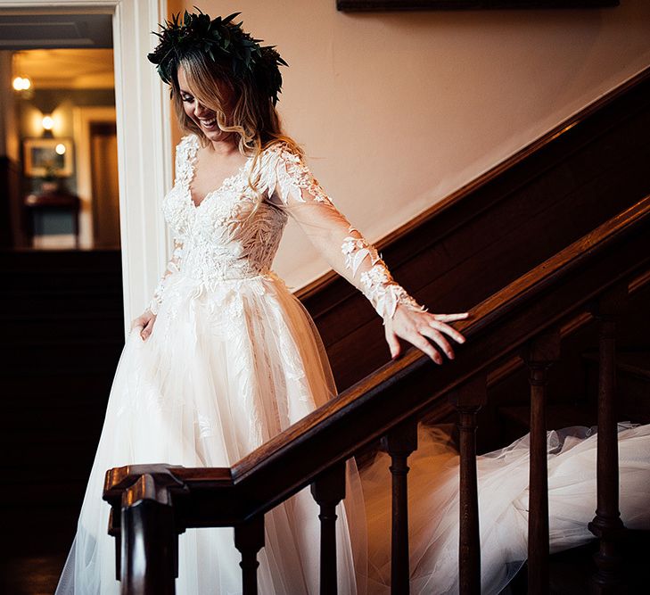 Bride in Riki Dalal wedding dress with foliage crown making her way to ceremony