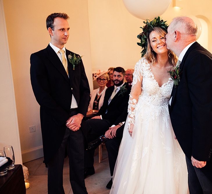 Bride in Riki Dalal wedding dress greets groom at Altar