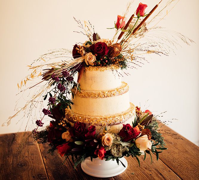 Wedding cake with red flower decor