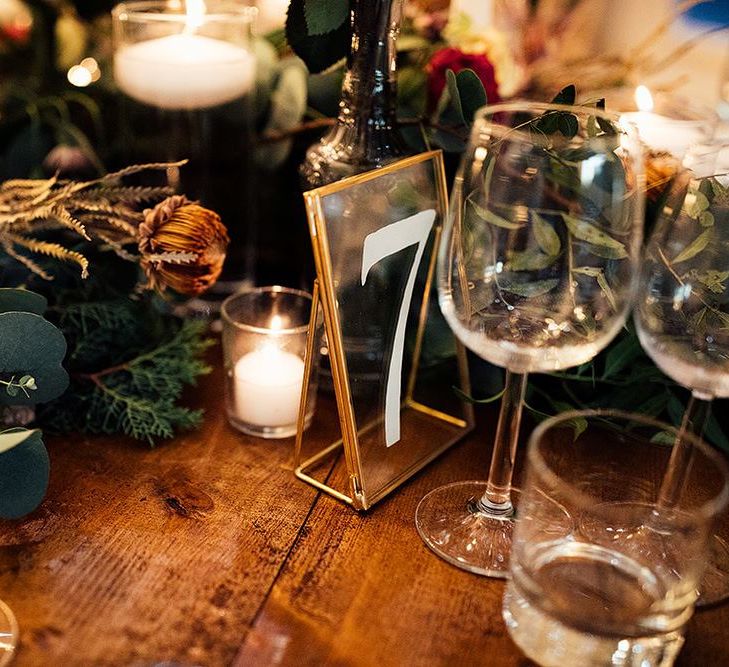 Winter wedding table decor with florals and gold details