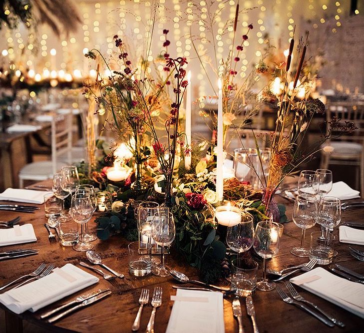 Winter wedding table decor with florals and gold details