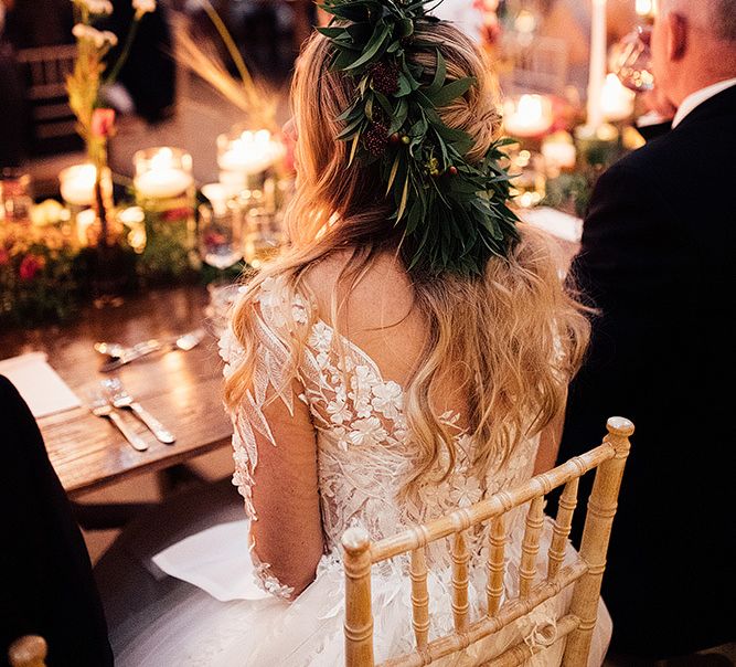 Bride in lace Riki Dalal wedding dress with foliage crown during wedding breakfast