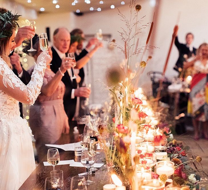 Bride in Riki Dalal wedding dress during wedding toast