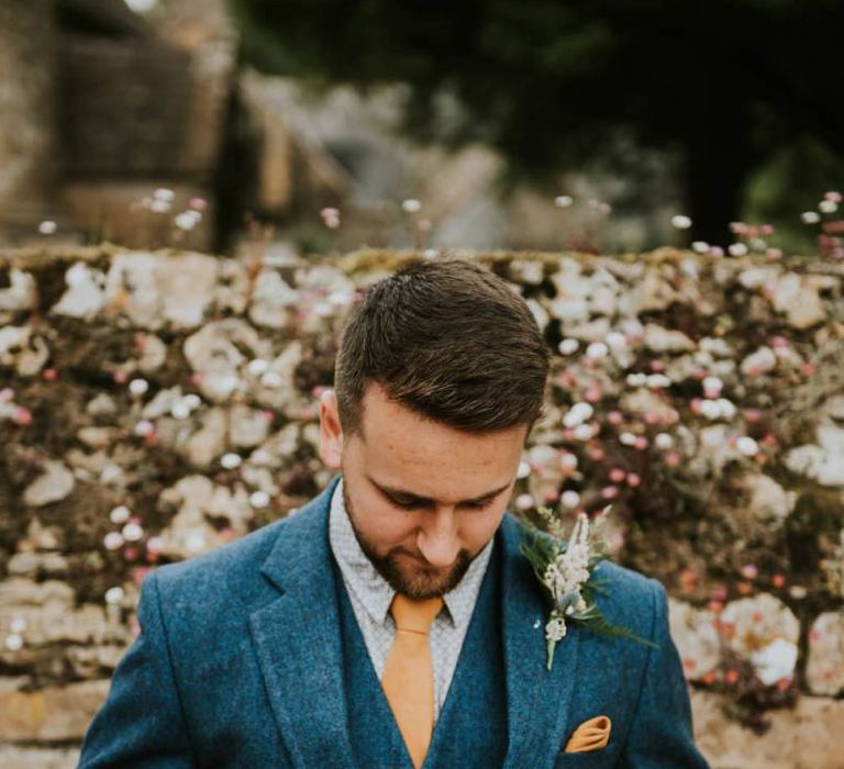 Groom in wooden suit and buttonhole