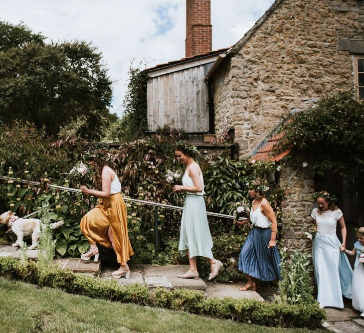 Bridal party make their way to outdoor ceremony