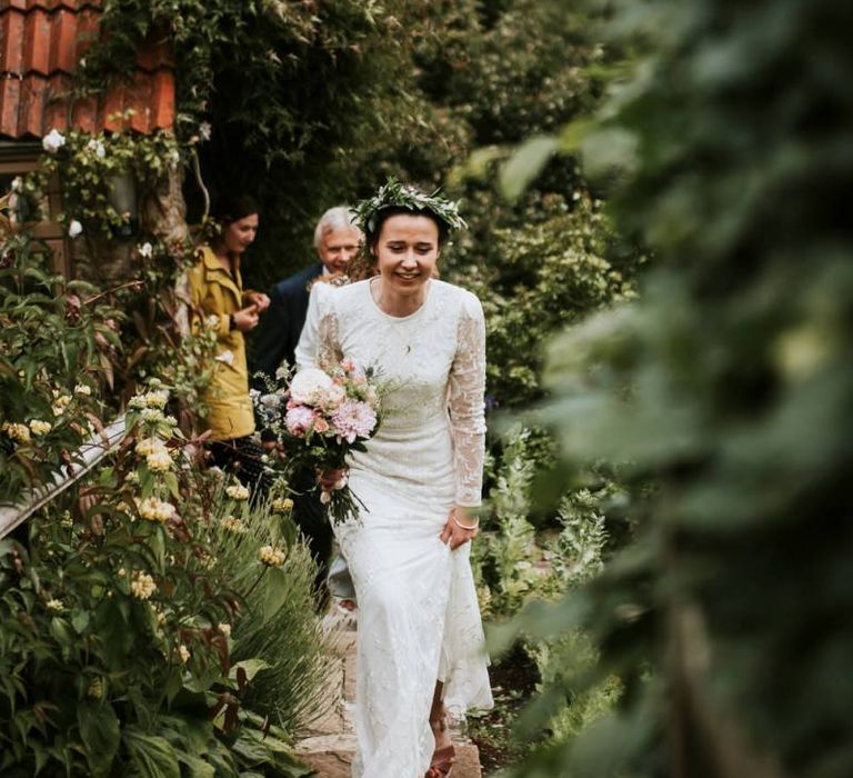 Bride in Savannah Miller wedding dress makes her way to outdoor ceremony