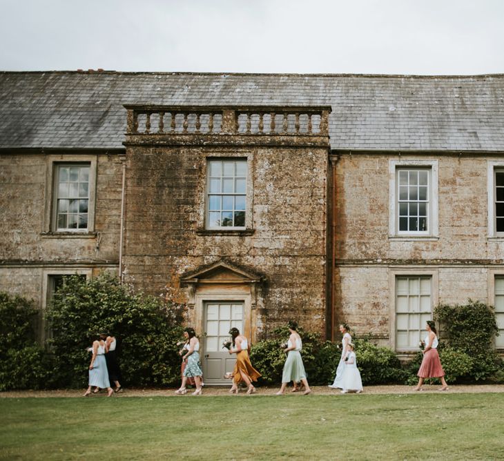 Bridal party make their way to outdoor ceremony