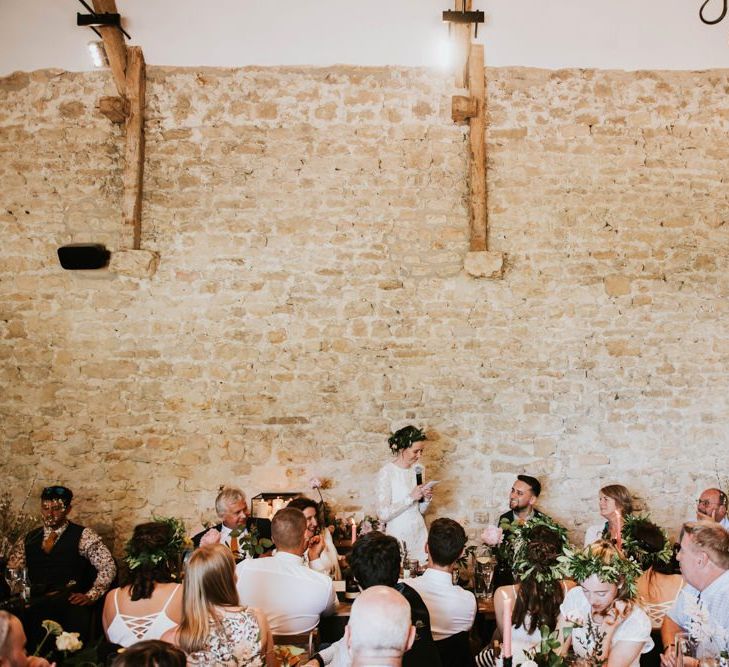 Bride in Savannah Miller wedding dress  makes wedding speech at rustic celebration