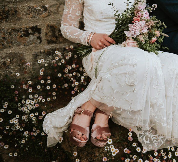 Lace Savannah Miller wedding dress with pink velvet shoes and blush bouquet