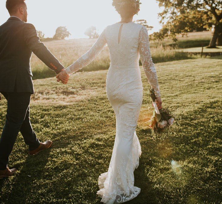 Savannah Miller wedding dress with lace detail and bouquet