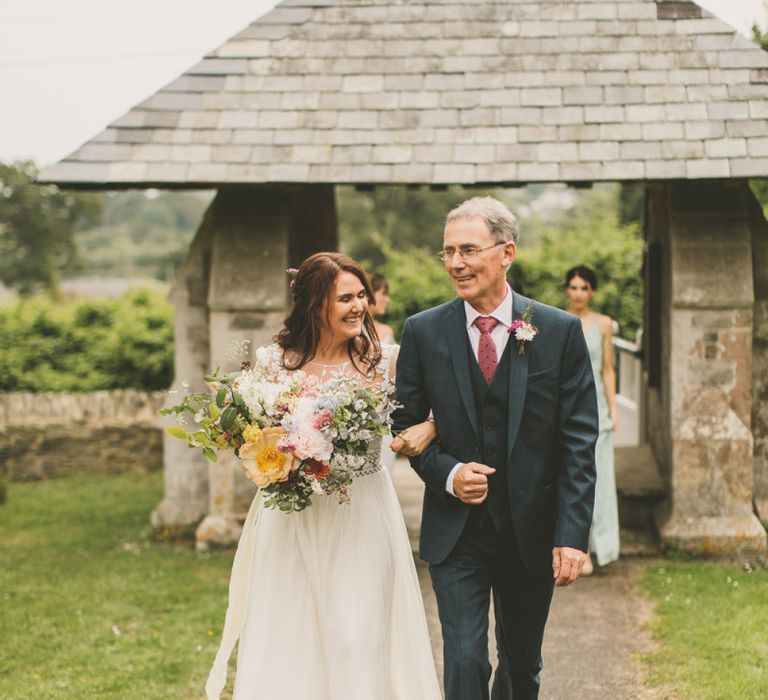 Bride arrives at church wedding ceremony