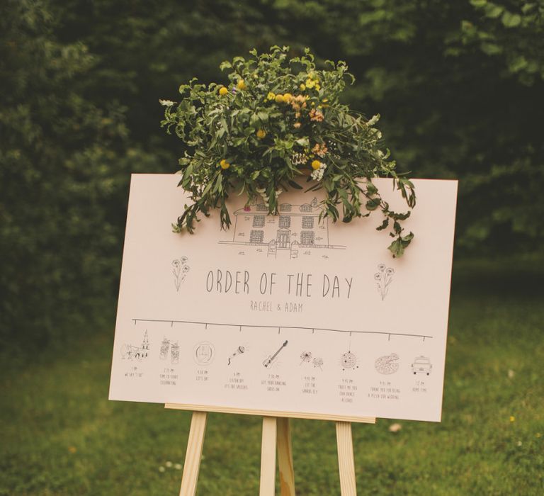 Order of the day for rustic wedding with macrame table runner