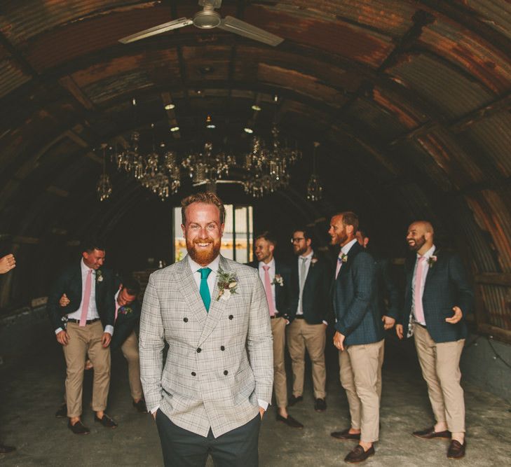 Groom with groomsmen in matching outfits