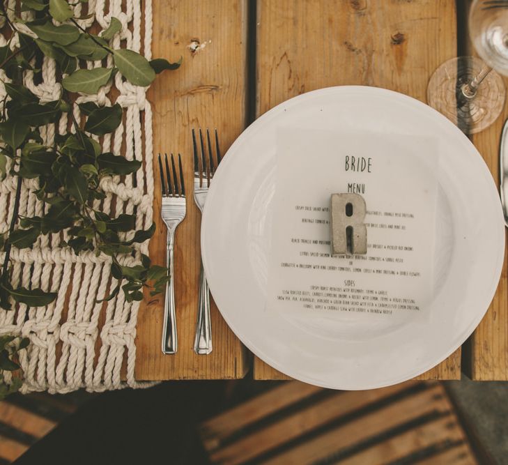 Clay initial place setting at wedding breakfast