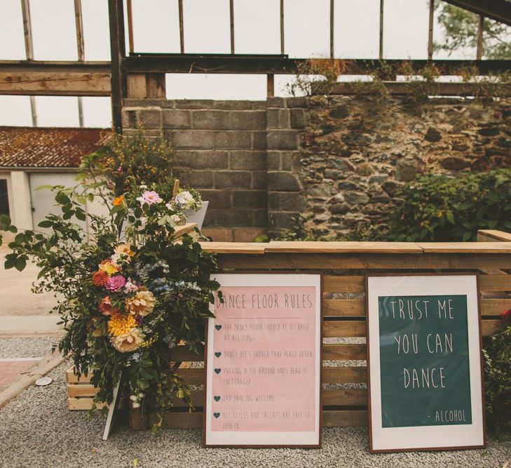 Homemade bar with wedding signs