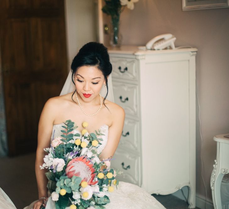 Bride on Wedding Morning Holding Protea Wedding Bouquet