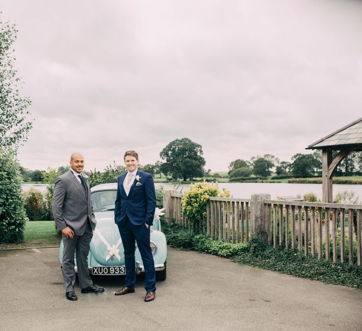 Groomsmen Standing in Front of Blue VW Beetle