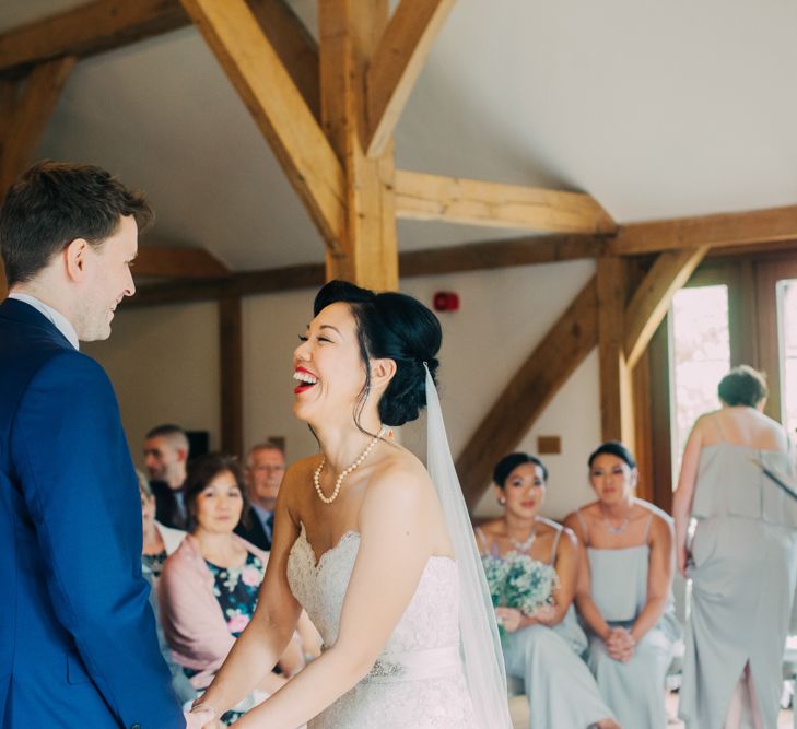 Bride and Groom Laughing During Wedding Ceremony