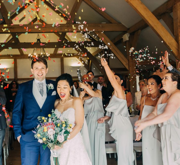 Bride and Groom Just Married Moment with Colourful Confetti Bomb