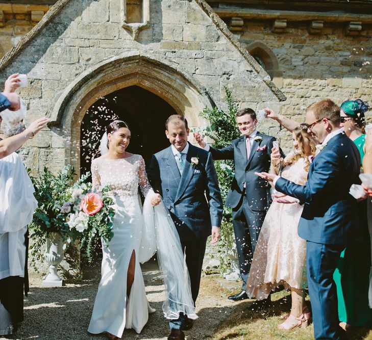 Church Confetti Exit with Bride in Applique Rime Arodaky Long Sleeve Wedding Dress and Groom in Checked Suit