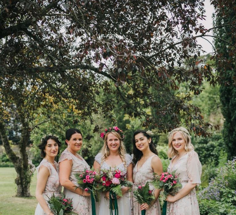 Pink bridesmaid dresses with bouquets